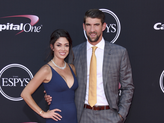 Plavec Michael Phelps s manželkou Nicole Johnson. 