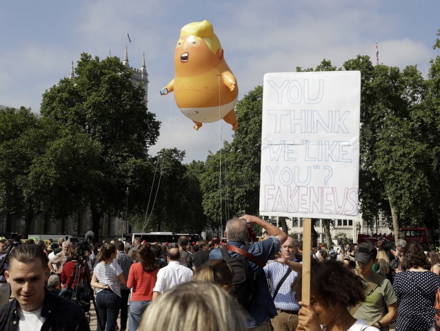 Britain Trump Protest Signs