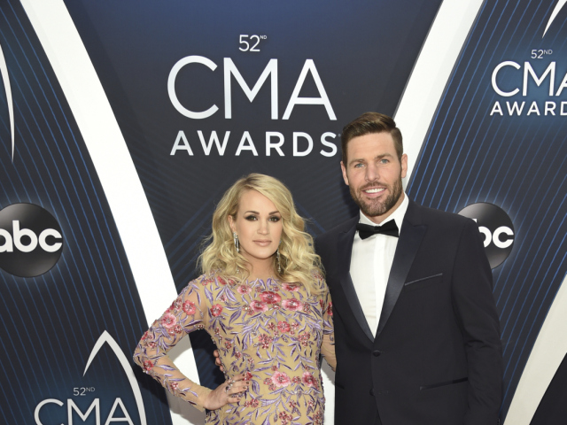 Tehotná speváčka Carrie Underwood a jej manžel Mike Fisher.