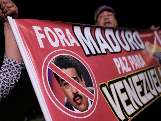 Venezuela, Juan Guaidó, Nicolas Maduro, demonštrácia, transparent