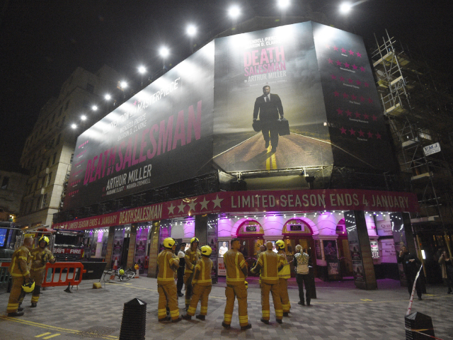 Firefighters outside the Piccadilly Theatre, London, after it was evacuated when part of its ceiling crashed down into the auditorium during a performance of Death of a Salesman. PA Photo. Issue date: