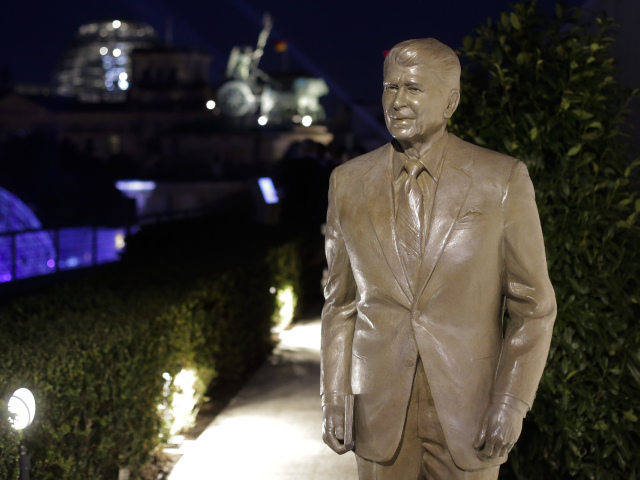 A statue of former President Ronald Reagan stands on the top of United States embassy after United States Secretary of State Mike Pompeo unveils the statue in Berlin, Germany, Friday, Nov. 8, 2019. 