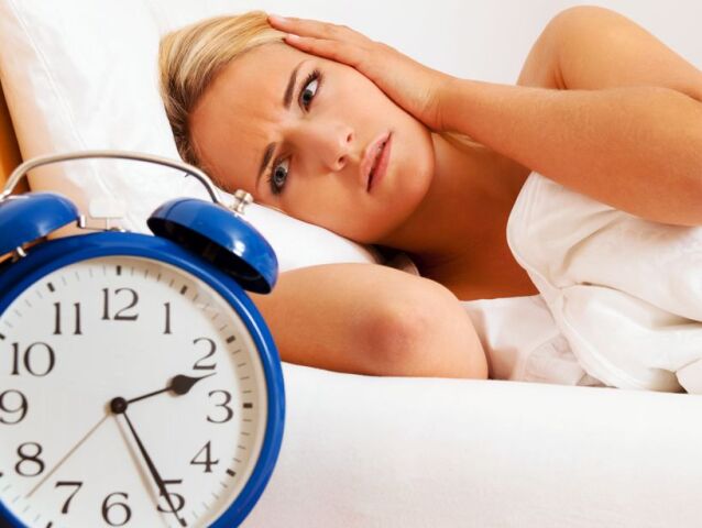 Clock with sleep at night. Woman can not sleep.