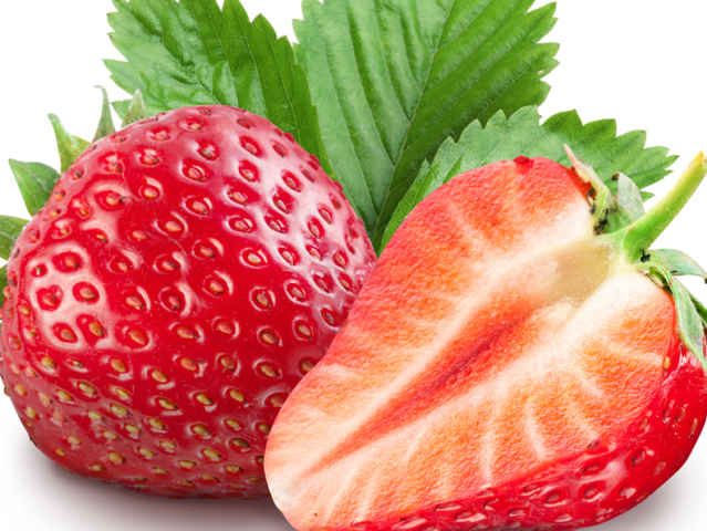 Strawberries with leaves. Isolated on a white background.