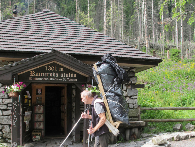 RAINER COTTAGE, HIGH TATRAS MOUNTAINS, SLOVAKIA - 10 JULY 2014 - Editorial: Mountain porter carrying heavy food supply to one of mountain huts.