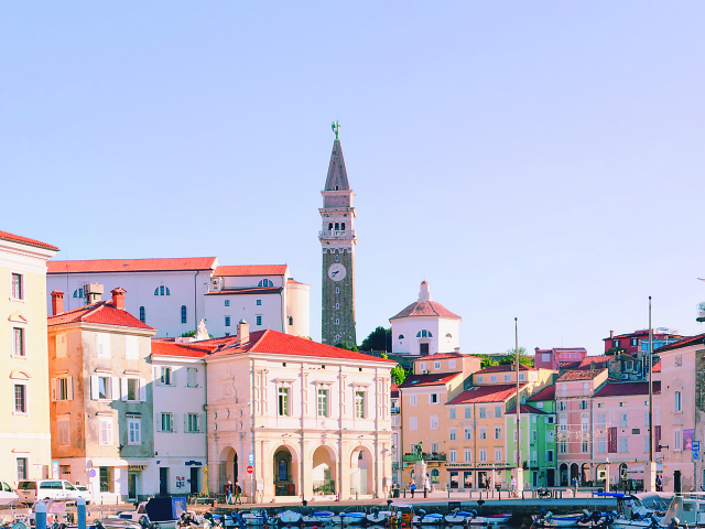 Piran. 09.08.2020. Scenic view of the town of Piran with the main square of Tartini, old colorful buildings with red roofs and the Adriatic Sea with yachts in the coast of Slovenia. Travel concept