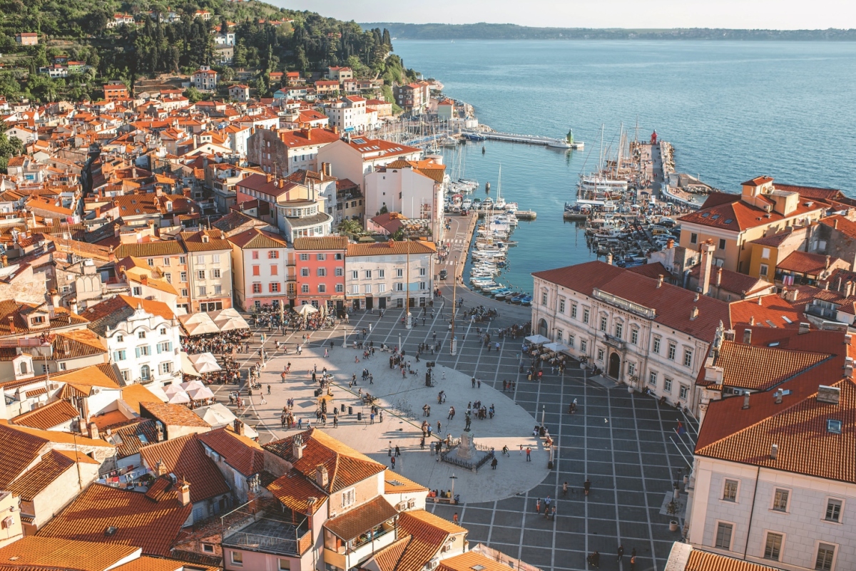 Beautiful aerial view on Piran town with Tartini main square, ancient buildings with red roofs and Adriatic sea in southwestern Slovenia