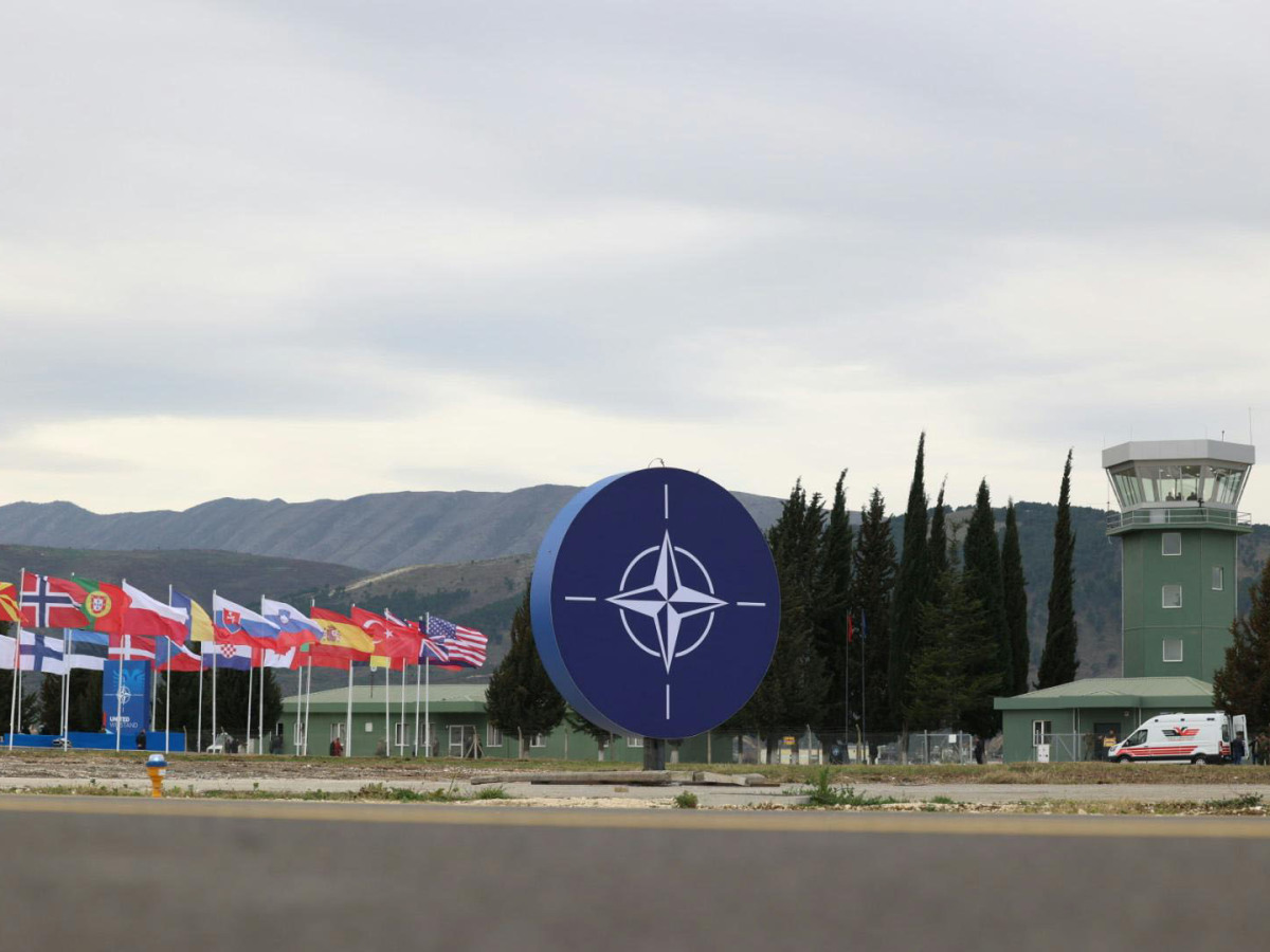 Kucova airbase NATO sign