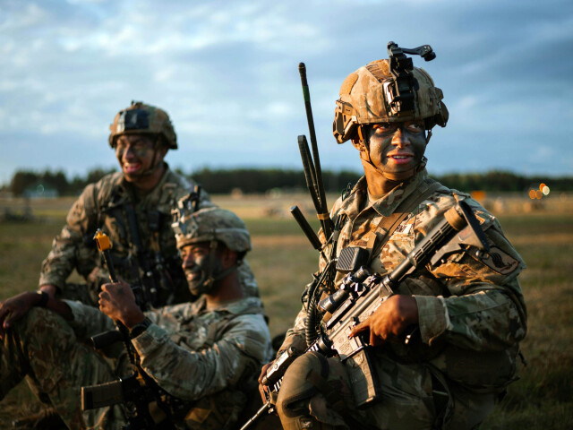 US Army paratroopers with the 173rd Airborne Brigade prepare to move out after landing near JĂ¶nkĂ¶ping, Sweden during exercise Swift Response 24.