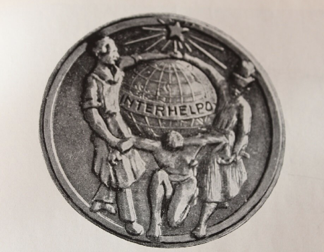 Logo družstva Interhelpo v Kirgizsku.