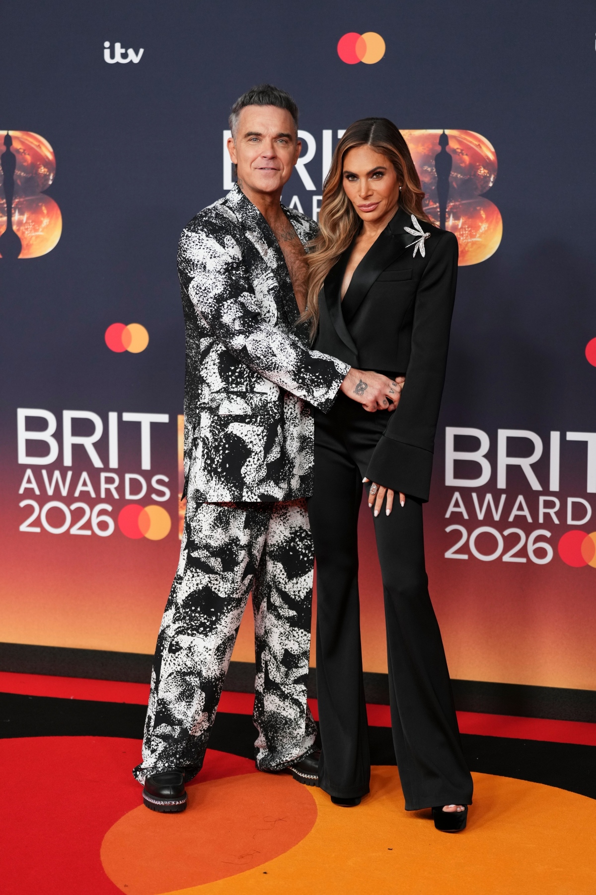 Spevák Robbie Williams a jeho manželka Ayda Field Williams.